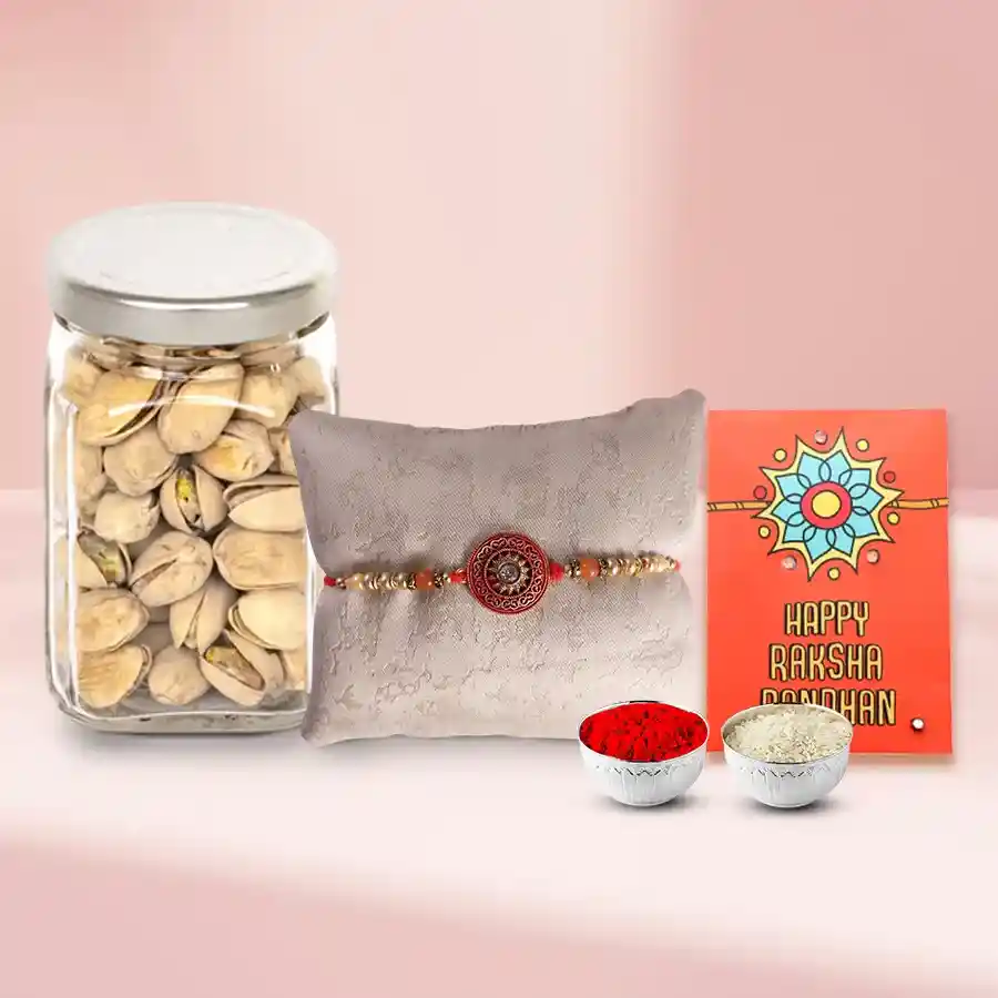 Salted Pistachios in a designer Glass Jar with a Rakhi with free Roli Tilak Chawal