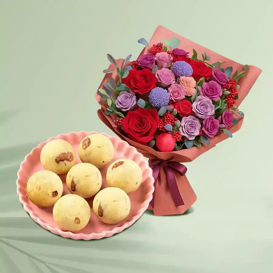 A vibrant designer bouquet with 30 assorted flowers paired with a box of 10 Rawa Laddu treats.