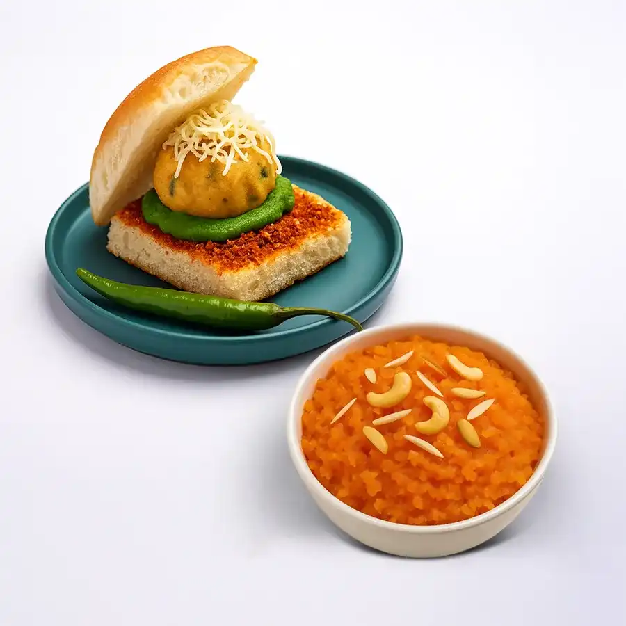 Sweet & Spicy Mumbai Duo featuring Damroot Halwa and Vada Pav in a beautifully arranged gift combo.