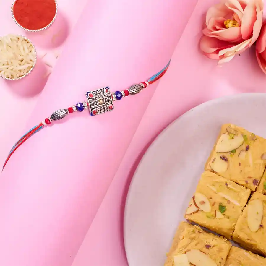 Radiant AD Rakhi and Sweet Soan Papdi Combo