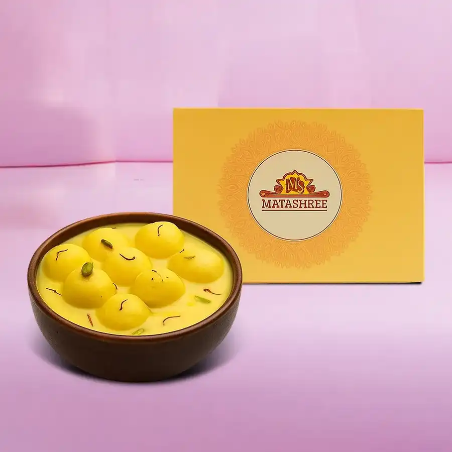 Ten pieces of luxurious Kesar Rasmalai in saffron milk, perfect for gifting or personal indulgence.
