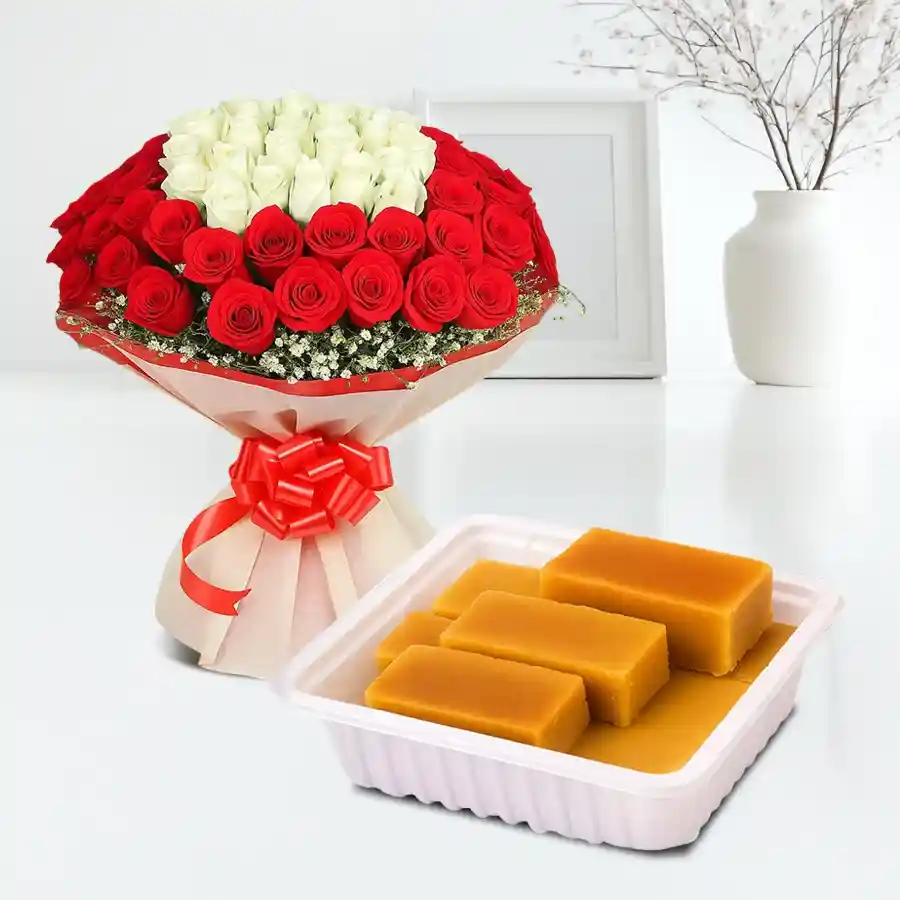 A beautiful bouquet of 25 red and white roses alongside a box of 250 grams of Mysore Pak sweets, representing love and indulgence.