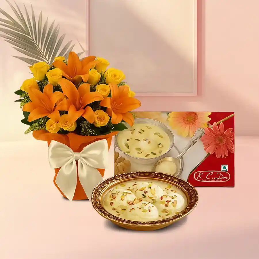 A bright bouquet of yellow roses and orange lilies paired with delicious Rosomalai treats.
