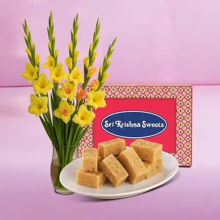 Stunning arrangement of purple orchids and pink roses with Badusha sweets, perfect for romantic occasions.