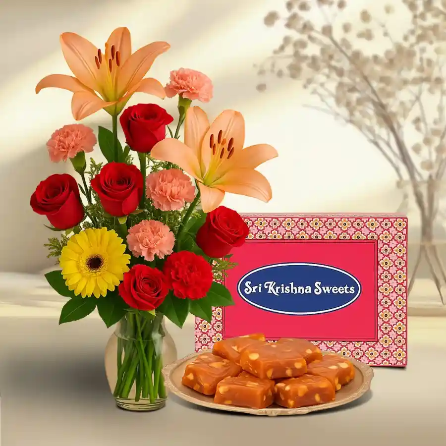 Elegant mixed flower arrangement with Bombay Halwa gift combo.