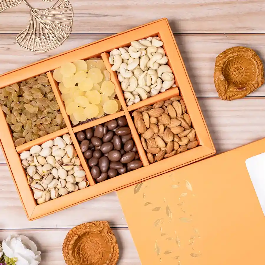 Nutty Harmony Diwali Hamper featuring premium dried fruits, nuts, and two mud diyas in a reusable gift box