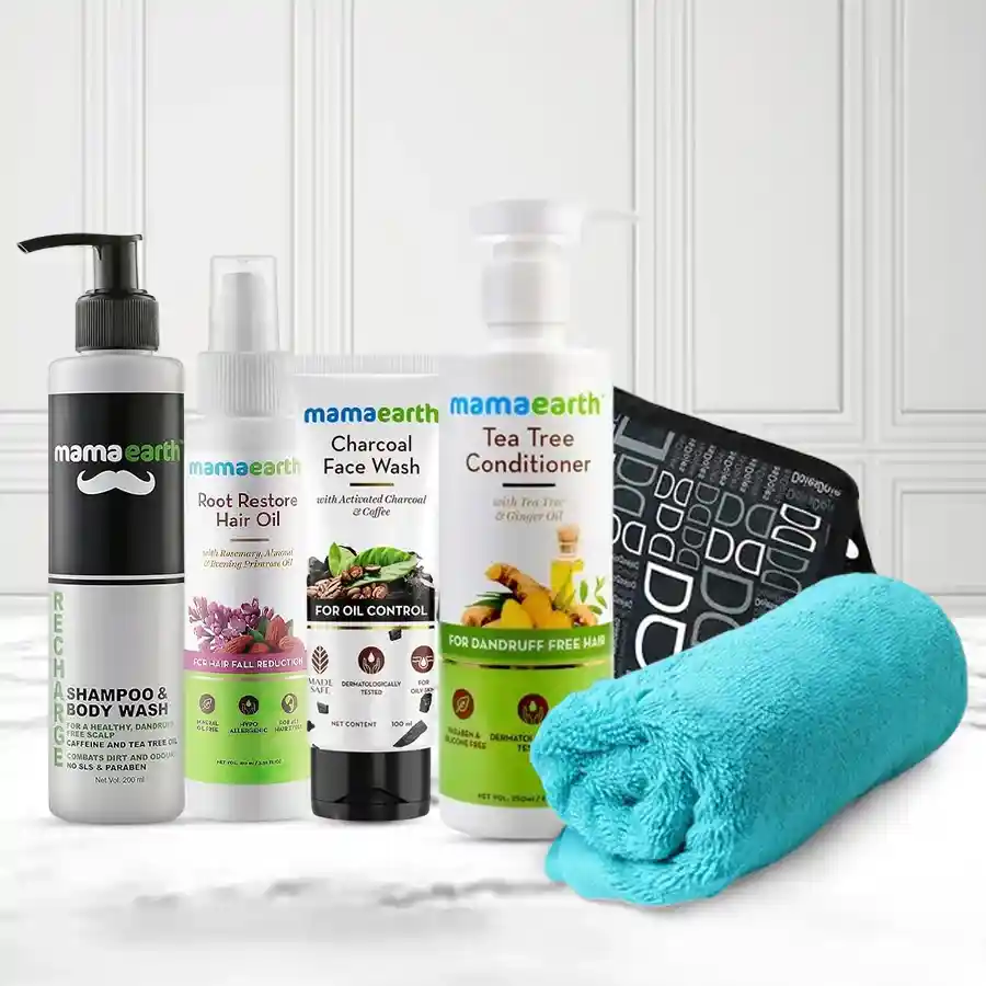 Essential Men's Care Gift Hamper featuring grooming products including face wash, conditioner, hair oil, shampoo, towel, and toiletry pouch.