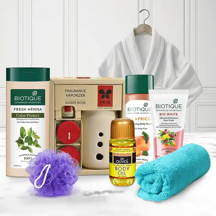 Luxurious Bath Hamper for Her featuring a bath robe, body wash, body oil, and more for an indulgent spa experience at home.
