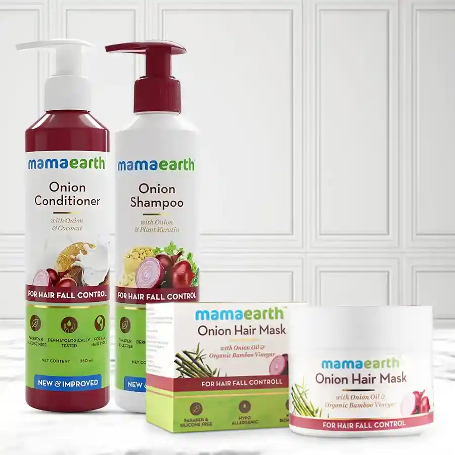 Mamaearth Onion Anti Hairfall Spa Kit featuring conditioner, hair mask, and shampoo for nourishing hair care.