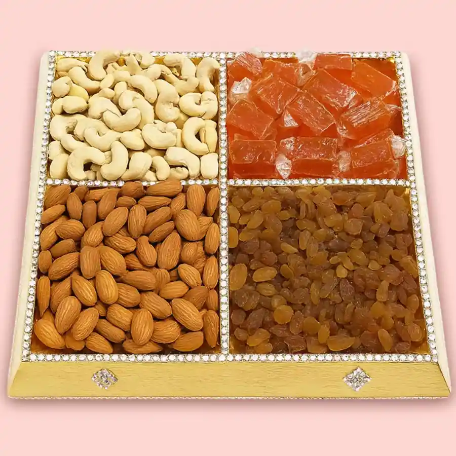 A beautifully arranged Delightful Dry Fruits Gift Tray featuring cashews, mango toffees, raisins, and almonds, perfect for gifting.