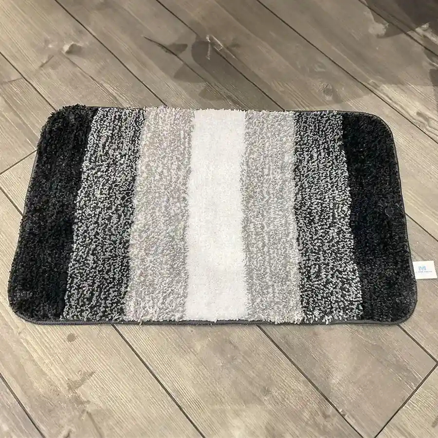 Stylish black striped anti-skid bath mat made from microfibre, perfect for enhancing bathroom safety and comfort.