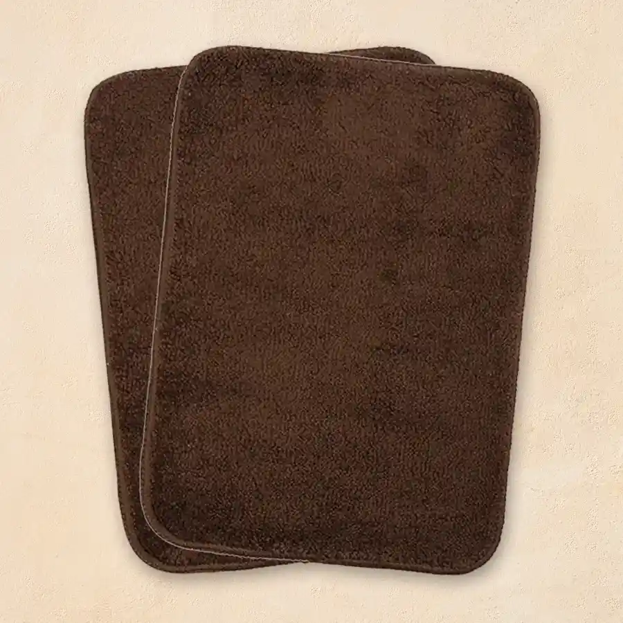 Set of 2 cozy brown rectangular bath mats made of microfiber with antiskid feature.