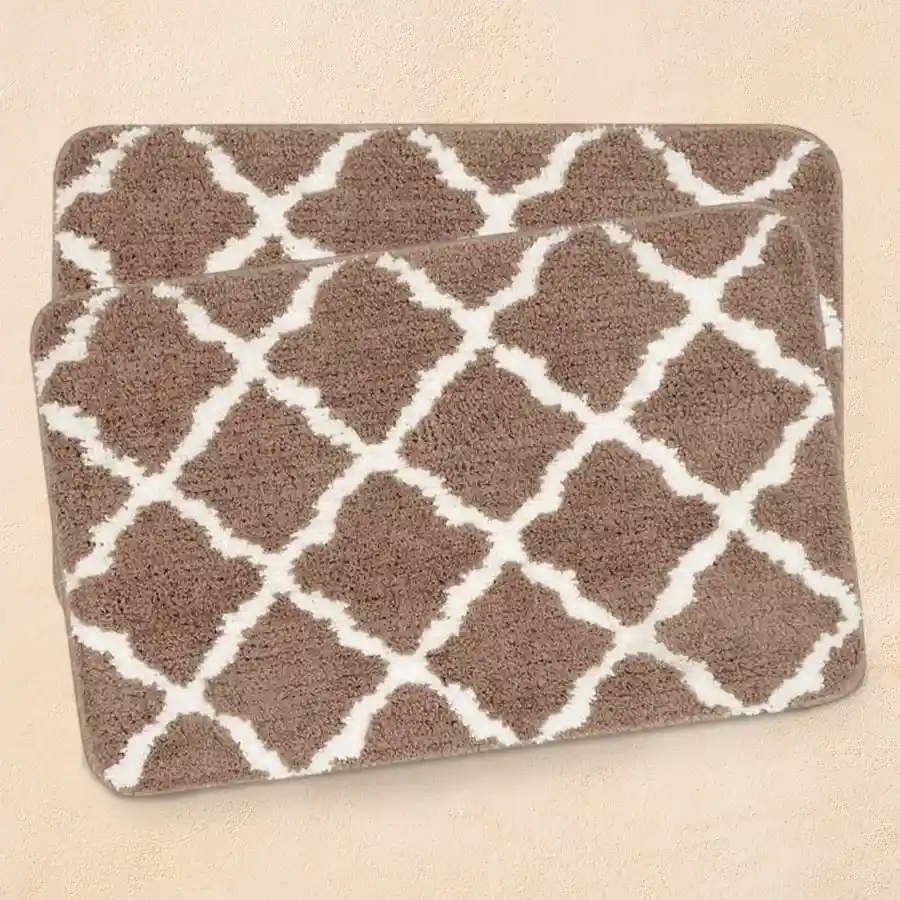 A stylish geometric bath mat set in beige, featuring soft microfiber, anti-skid properties, and a modern tufted design for bathroom comfort.