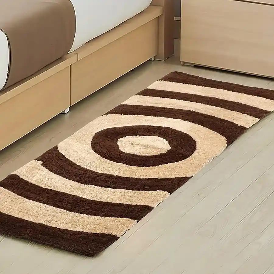 Chic Shaggy Bedside Runner Rug in beige, made of soft microfibre polyester, featuring an antiskid design, perfect for stylish bedroom comfort.