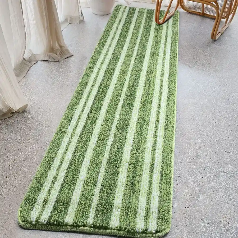 Cozy green microfiber anti-slip bedside runner, soft and tufted design, perfect for adding comfort and safety to your bedroom.