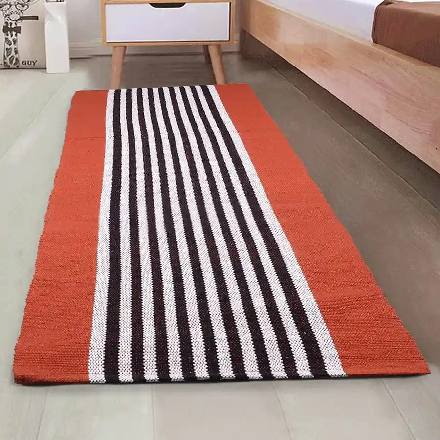 Chic orange striped cotton multi-purpose runner, measuring 45x120 cm, perfect for adding warmth and charm to any space.