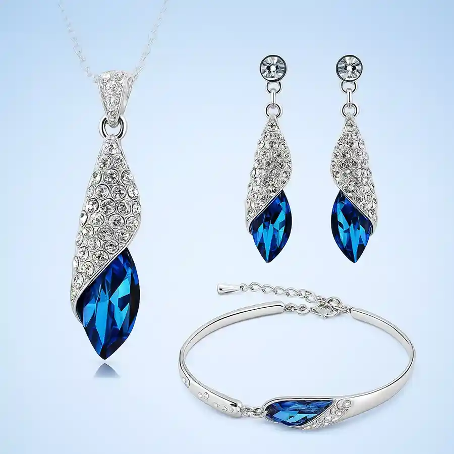 Heartfelt Crystal Jewellery Set with silver plating, blue crystals, and matching necklace, earrings, and bracelet.