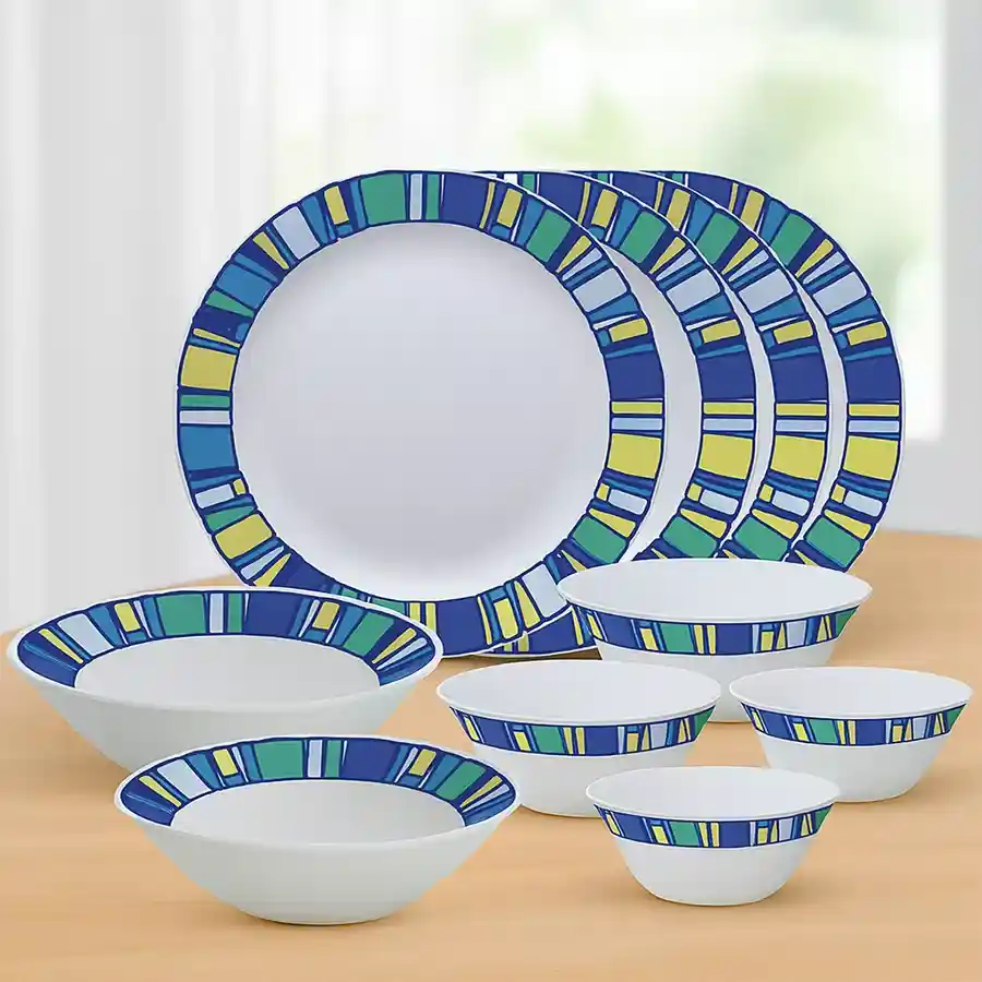 Elegant Opalware Dinner Set by Larah, featuring white and sapphire design, includes plates and bowls for a complete dining experience.