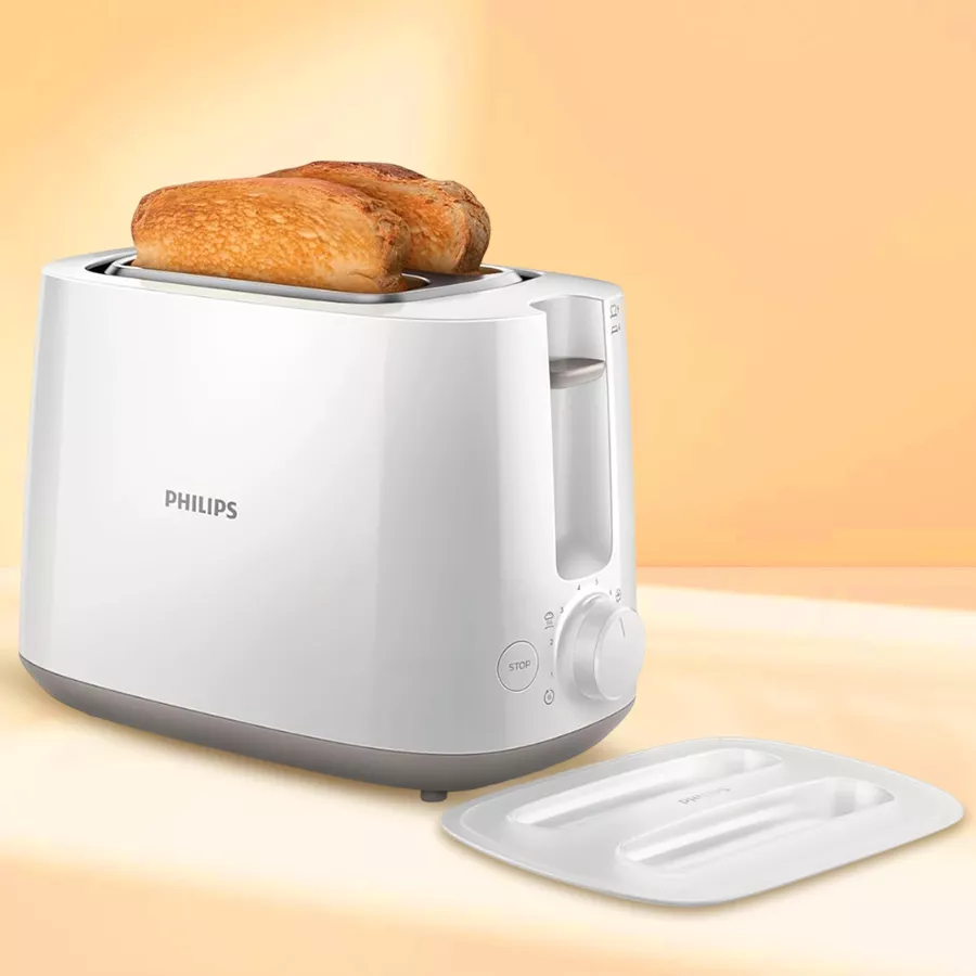 Perfect Philips 2-Slice Toaster in white, featuring integrated cord storage and a dust cover, ideal for effortless breakfast preparation.