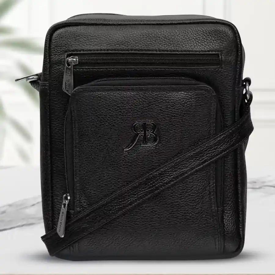 Pure Bliss Gents Casual Sling in Black, stylish leather bag for men with front pocket design.