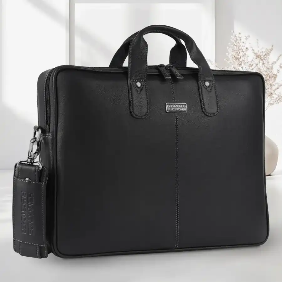 Stylish leather laptop bag for men in black, fitting 14-16 inch laptops. Perfect for professionals seeking elegance and functionality.