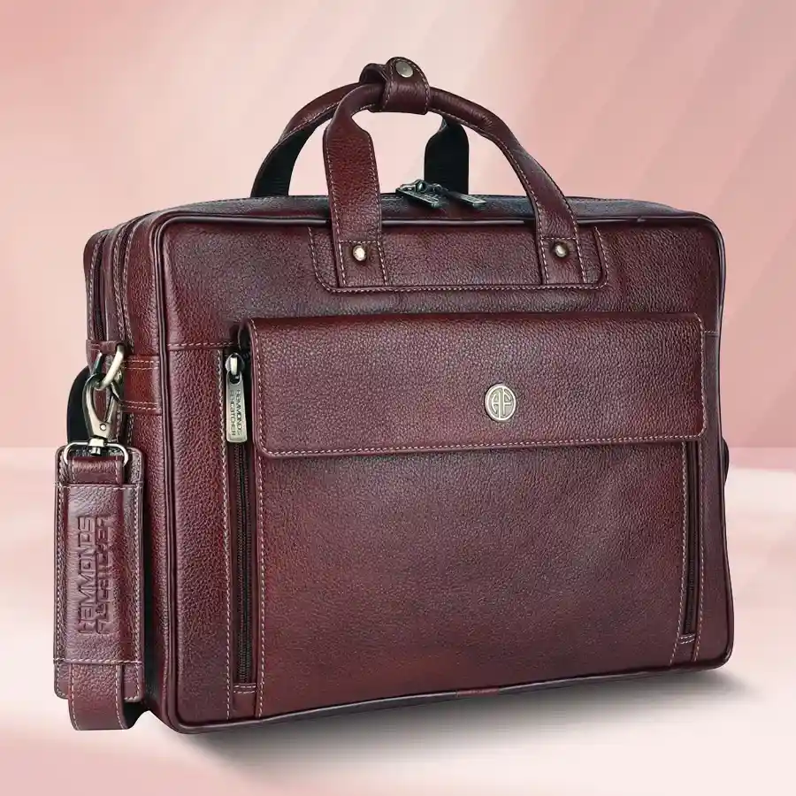 Sophisticated Expandable Leather Laptop Bag for men, crafted from genuine leather, fits laptops up to 15.6 inches, featuring adjustable strap and expandable design.