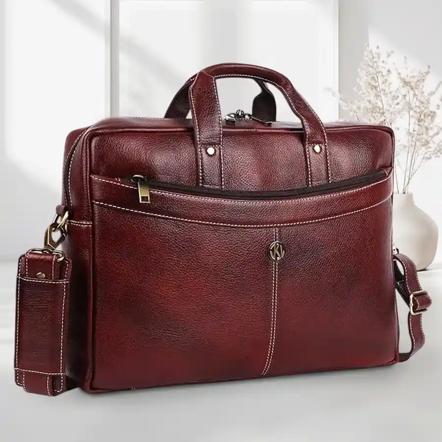 Elegant brown leather laptop messenger bag for men, fits up to 16-inch laptops, stylish and functional with multiple compartments.