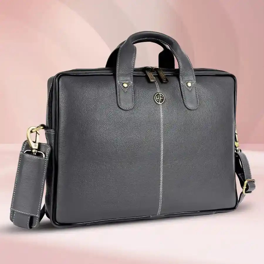 Stylish grey laptop bag for men, fits up to 14-inch laptops, made from premium leather, includes a 1-year warranty.