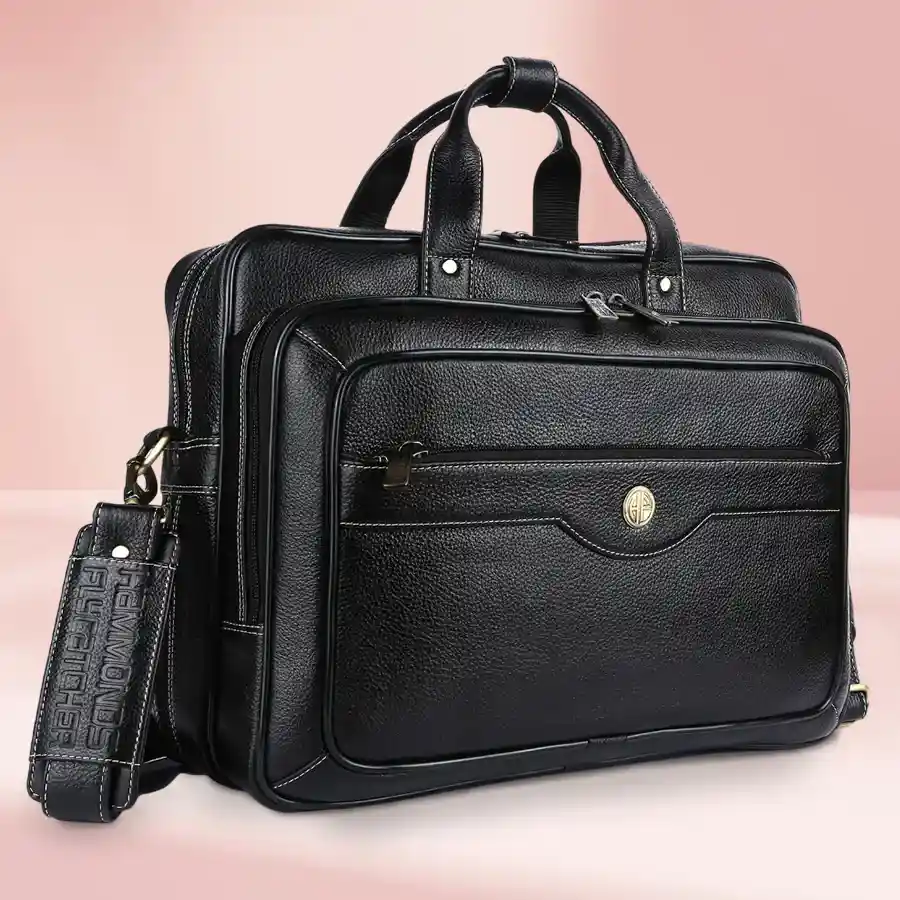Exclusive leather laptop bag for men, fits up to 16 inches, designed with adjustable strap and organized compartments in classic black.