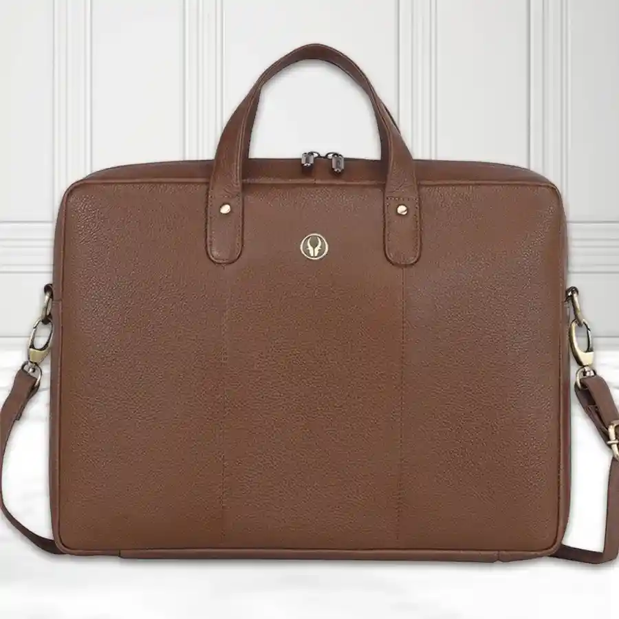 Stylish faux leather laptop sleeve in burlywood, designed for laptops up to 15.6 inches, featuring a soft interior lining and secure zipper closure.