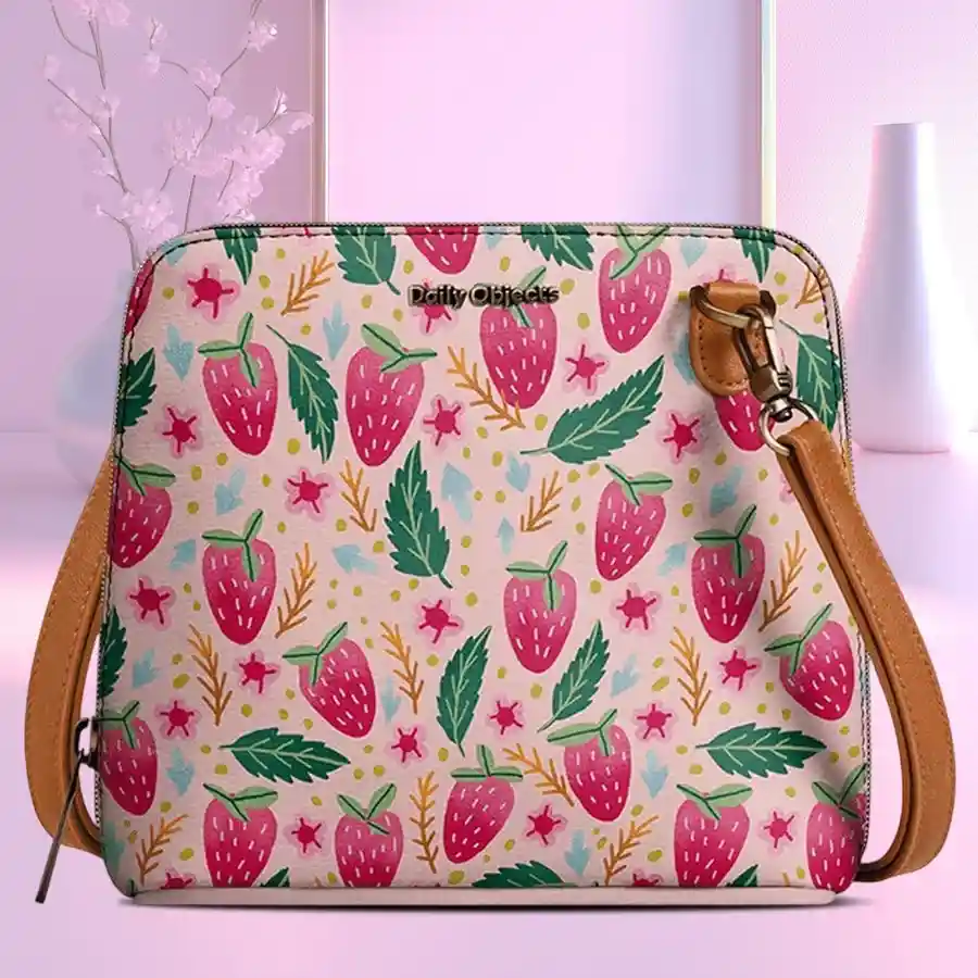 DailyObjects Trapeze Sling Crossbody Bag in vibrant multicolor, made from vegan leather, featuring zippered compartments and adjustable straps.