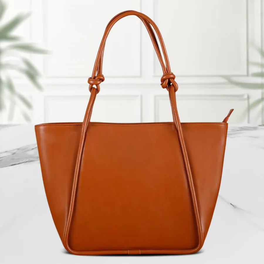 Chic brown faux leather shoulder bag with a unique bottom belt design, featuring two compartments for organized storage.