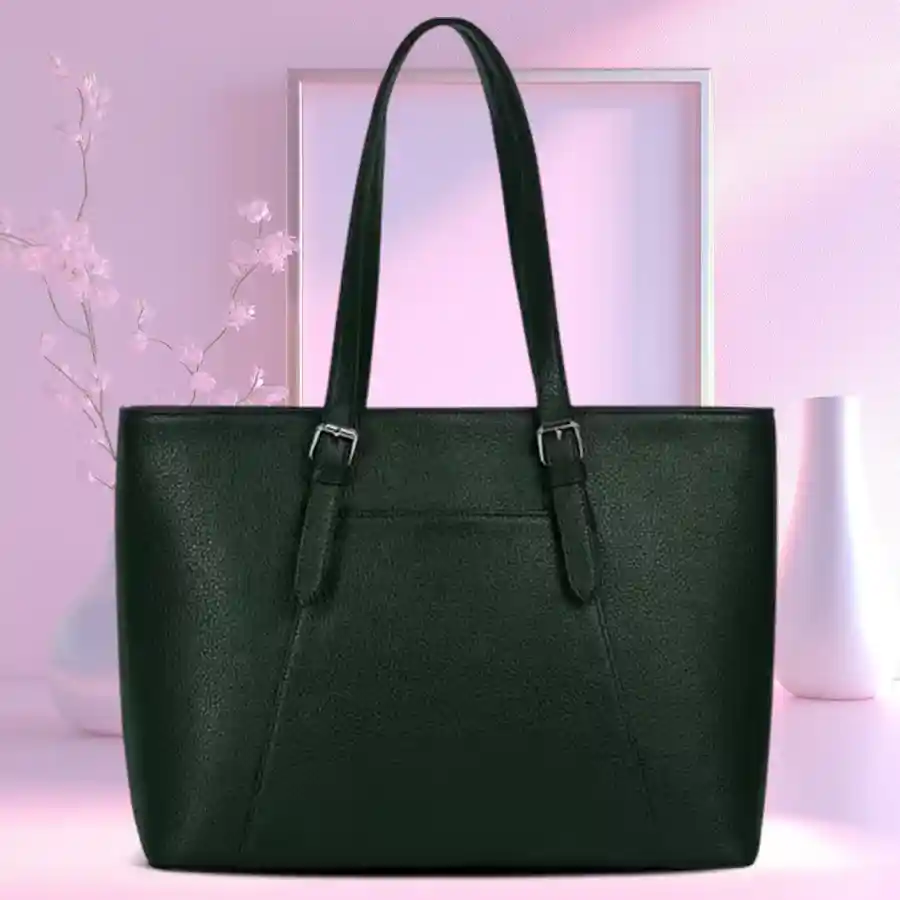 Attractive dark green ladies shoulder bag with intricate embroidery design.