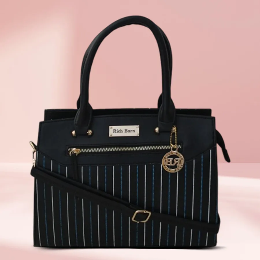 Chic striped faux leather shoulder bag in black with blue and golden stripes.