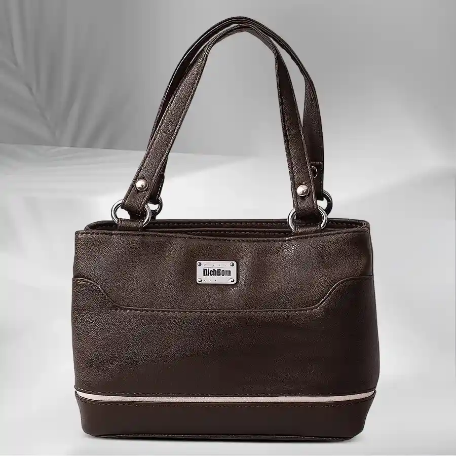 Chic Dark Brown Mini Leather Bag with white border and two compartments, perfect for stylish organization.