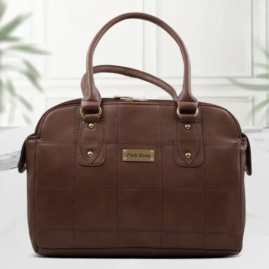 Chic ladies' deep brown shoulder bag with smart stitch design and detachable strap.