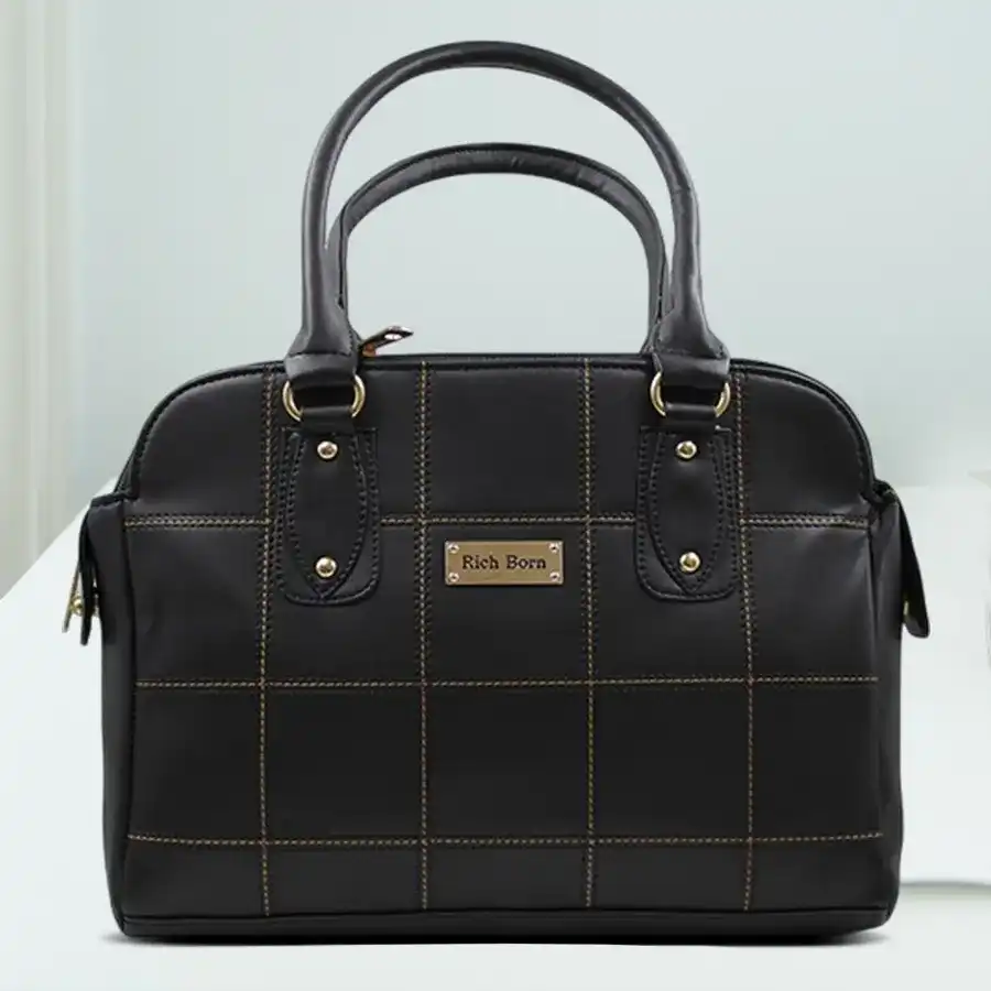 Elegant black faux leather shoulder bag with smart stitch design and detachable strap.