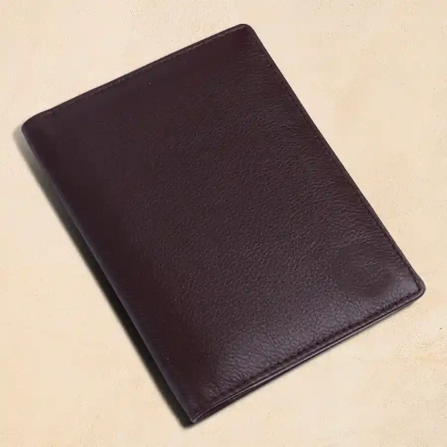 Sophisticated RFID leather passport holder in brown with slots for passport and cards.
