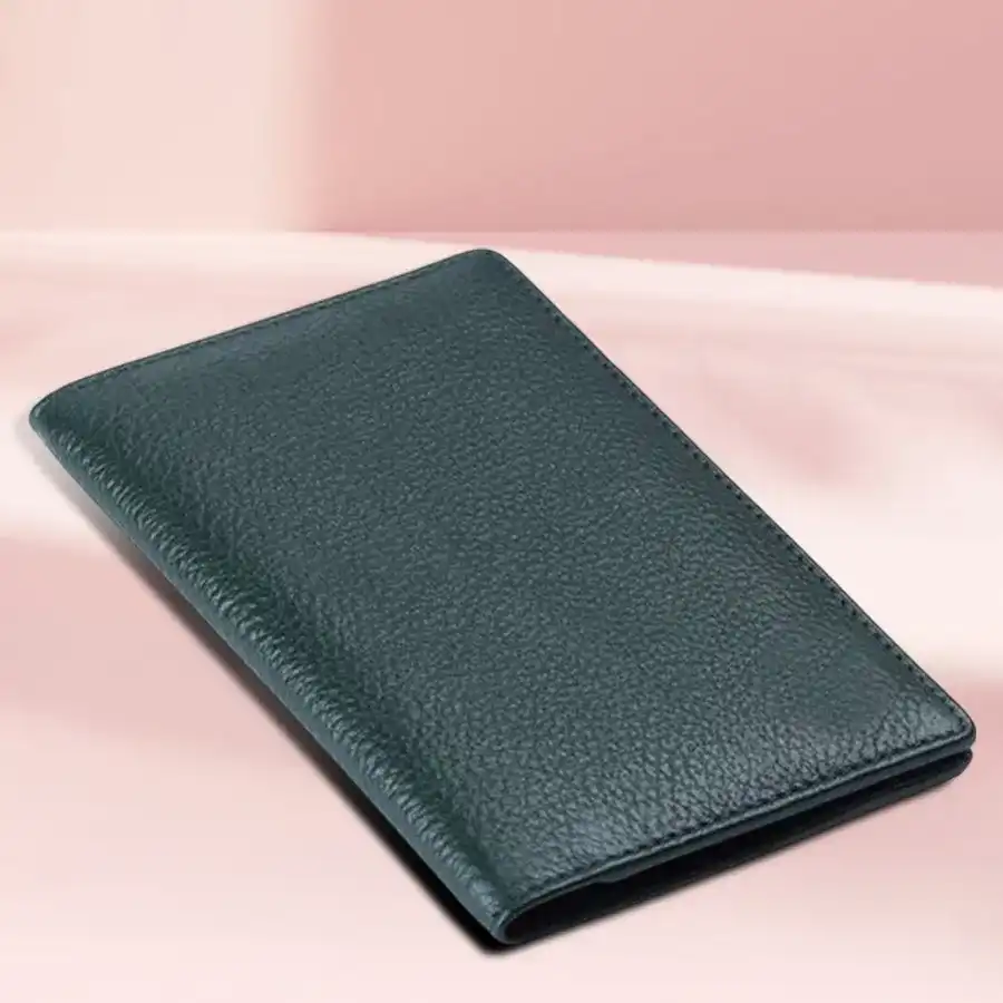 Stylish green leather travel passport holder with RFID protection and organized slots for passport, cards, and ID.