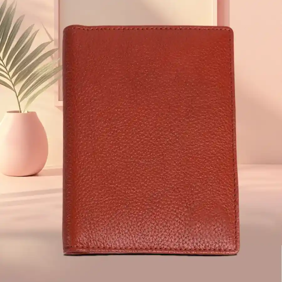 Elegant tan leather passport holder with RFID protection and slots for passport, cards, and ID.