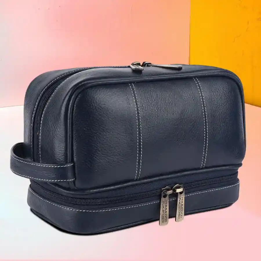 Stylish royal blue leather toiletry bag with multiple compartments for travel essentials.